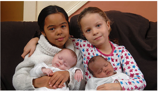 A family gifted with rare black white twins receive the same blessing
